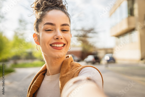 self portrait selfie young Caucasian woman stand outdoor happy smile Fototapet