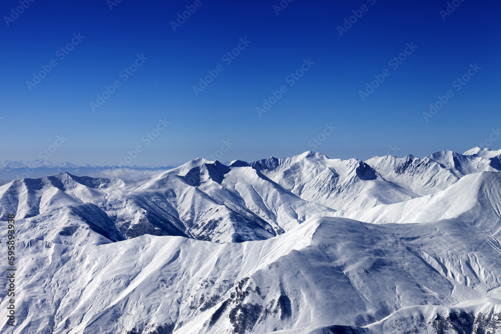 Winter snowy mountains at nice sun day
