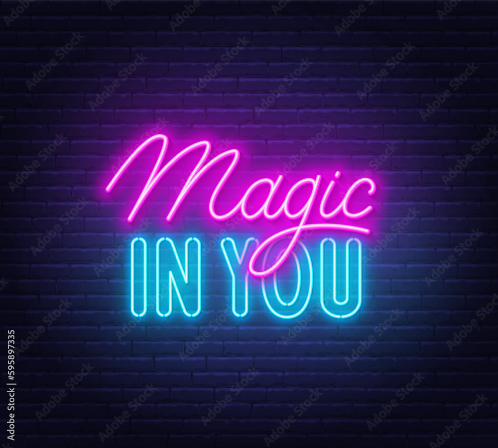 Magic in You neon quote on brick wall background.