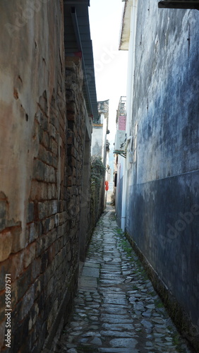 The beautiful traditional Chinese village view with the classical architecture and narrow lane  as background © Bo