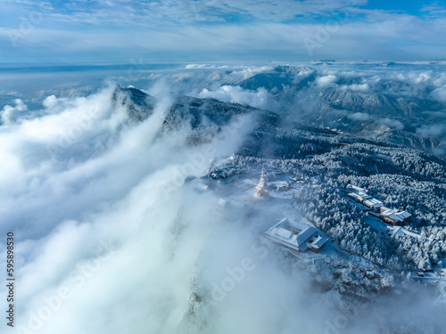 Aerial photography of snow covered Mount Emei in winter, the golden summit of Mount Emei in Sichuan(Huazang Temple), a famous Buddhist mountain in China photo