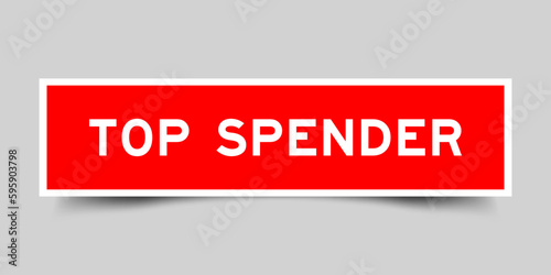 Sticker label with word top spender in red color on gray background