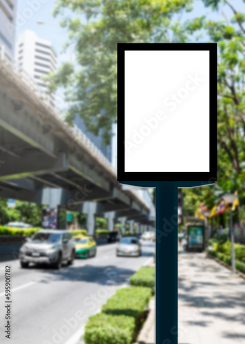 Outdoor pole vertical light box billboard with mock up white screen on footpath and clipping path