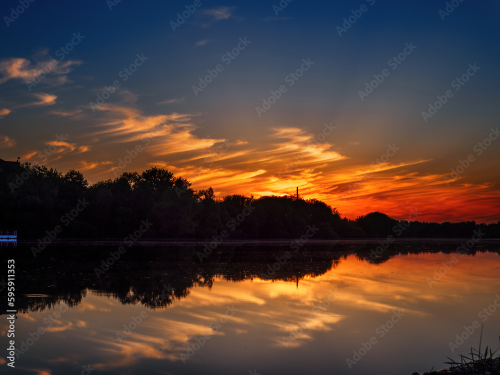 Colorful sunset over the river, summer landscape