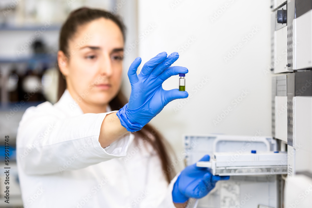 Young woman scientist holding test tube with lab glassware, science laboratory research and development concept, laboratory research Young woman scientist holding test tube with lab glassware, science laboratory research and development concept, laboratory research