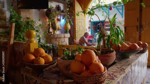 Close up bowls with oranges in the restaurant entrance in Sousse. Traditional african style restaurant in old medina. photo