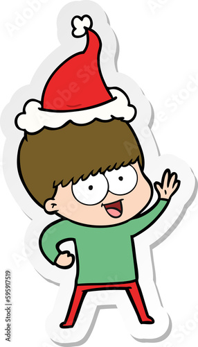 happy hand drawn sticker cartoon of a boy wearing santa hat © lineartestpilot
