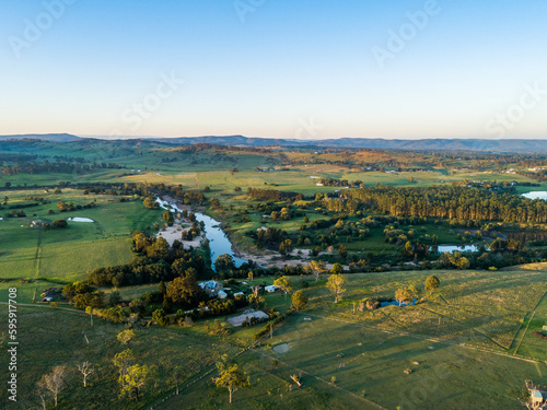 Aerial view of farms in Aberglasslyn over hunter river to Maitland Vale at dusk photo
