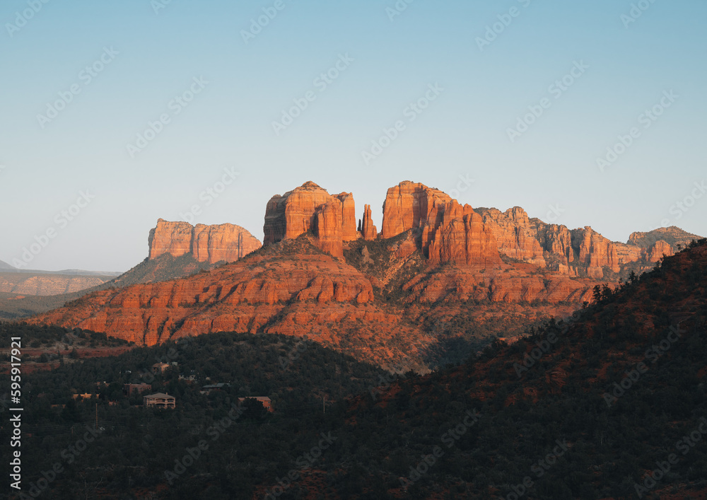 A close up on the sandstone saddle points, or gaps of Cathedral Rock, one of the most famous natural landmarks surrounding the desert town of Sedona, Arizona, in the Coconino National Forest, USA. A close up on the sandstone saddle points, or gaps of Cathedral Rock, one of the most famous natural landmarks surrounding the desert town of Sedona, Arizona, in the Coconino National Forest, USA.