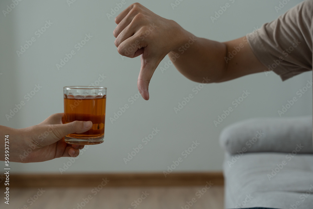 man refuses say no and avoid to drink an alcohol whiskey , stopping hand sign male, alcoholism treatment, alcohol addiction, quit booze, Stop Drinking Alcohol. Refuse Glass liquor, unhealthy, reject. man refuses say no and avoid to drink an alcohol whiskey , stopping hand sign male, alcoholism treatment, alcohol addiction, quit booze, Stop Drinking Alcohol. Refuse Glass liquor, unhealthy, reject.