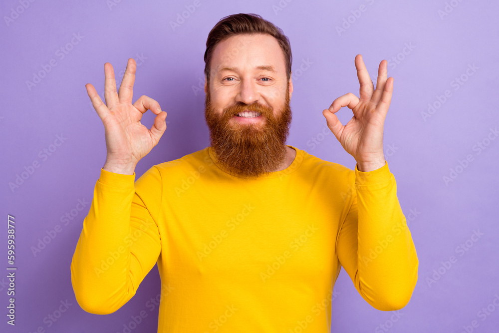 Photo of young businessman wear yellow pullover show double okey sign satisfied high quality products isolated on violet color background Photo of young businessman wear yellow pullover show double okey sign satisfied high quality products isolated on violet color background