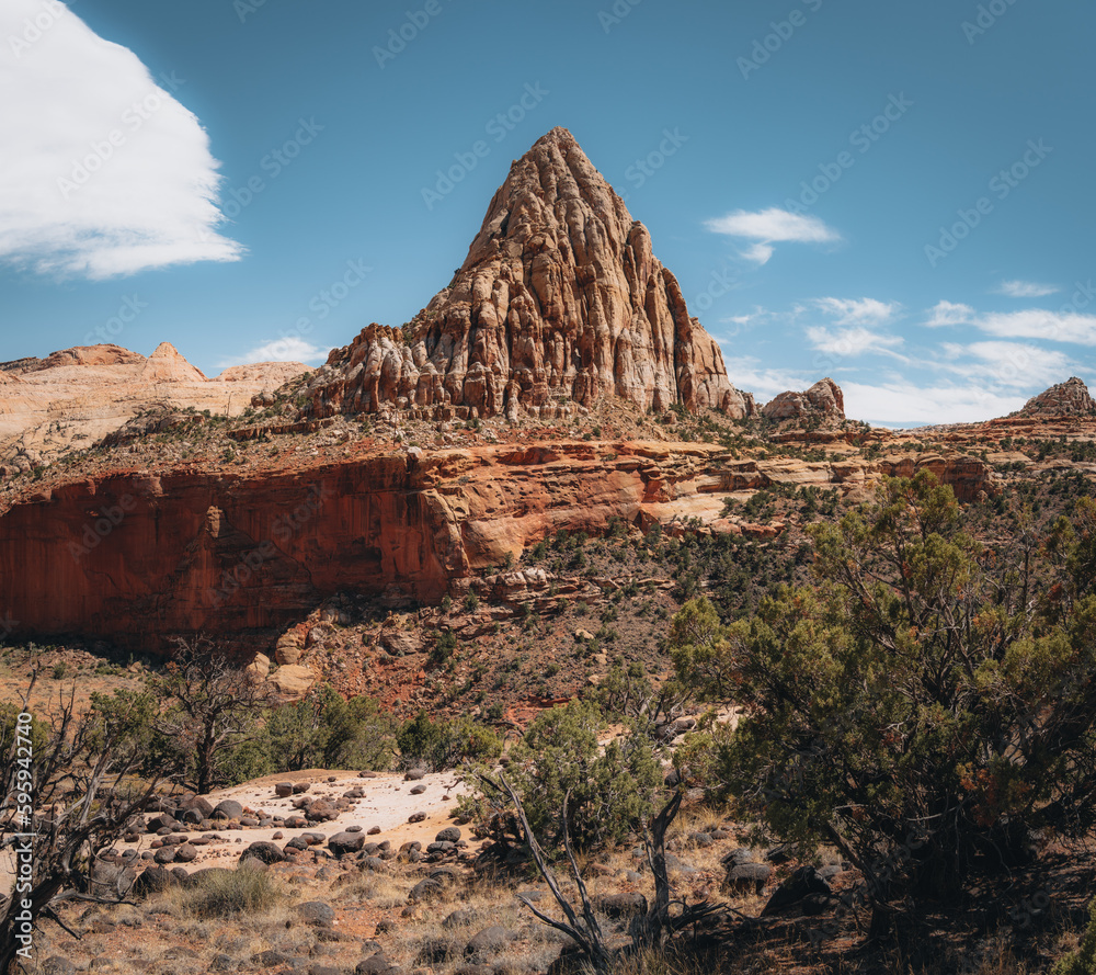 Fototapeta premium USA, Utah, Capitol Reef National Park. The Castle rock formation and Fremont River. Beautiful Pectols Pyramid from the Hickman Bridge Trail of Capitol Reef National Park at Utah