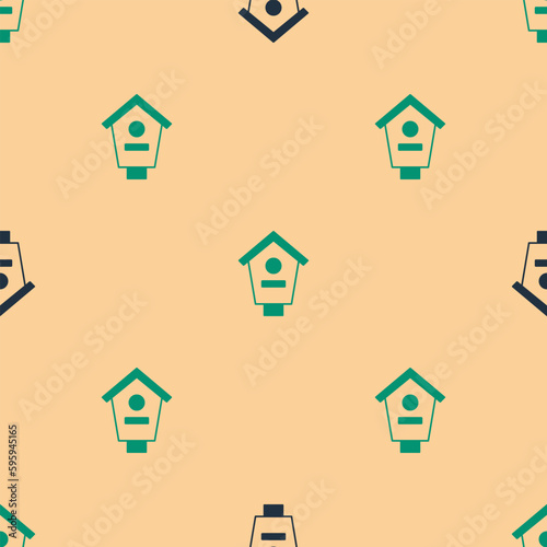 Green and black Bird house icon isolated seamless pattern on beige background. Nesting box birdhouse, homemade building for birds. Vector