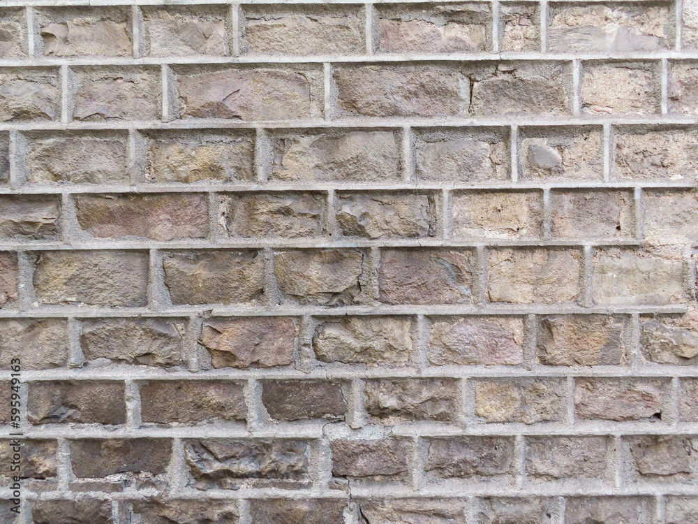 Textured stone sandstone surface. Close up image bricks