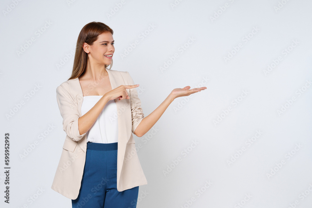Happy young woman presenting or showing open hand palm with copy space for product isolated on white background. Happy young woman presenting or showing open hand palm with copy space for product isolated on white background.