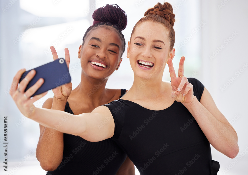 Well always remember these moments. two ballerinas taking selfies using a smartphone.