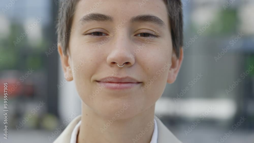 Portrait of Attractive Caucasian Businesswoman Standing, Smiling Looking at Camera Outside Near Business Center. Successful Career Attractive Manager, Cuten and Confident. Close Up Portrait of Attractive Caucasian Businesswoman Standing, Smiling Looking at Camera Outside Near Business Center. Successful Career Attractive Manager, Cuten and Confident. Close Up
