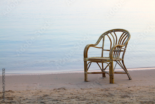 chair on the beach © YURII DMYTRIIEV