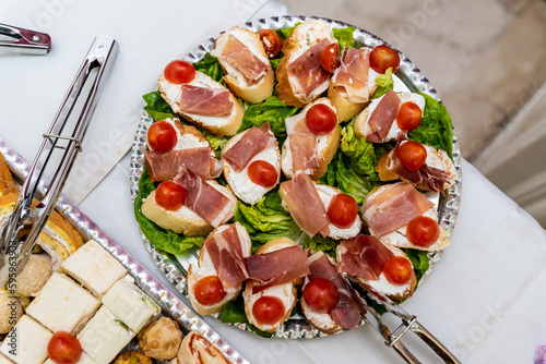 Various delicious canapés served in a plate on the table