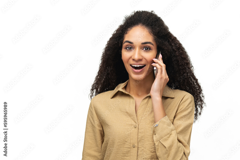 Young positive ethnic African-American woman holding phone conversation, making call, having conversation standing isolated on white, ad concept Young positive ethnic African-American woman holding phone conversation, making call, having conversation standing isolated on white, ad concept