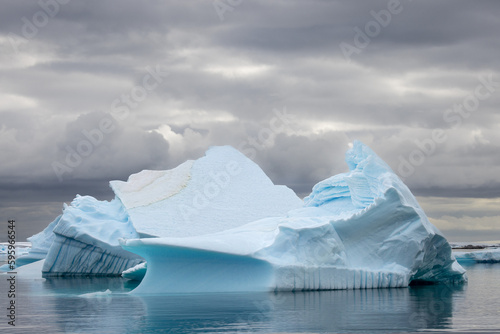 Impressive iceberg with blue ice in Antarctica  scenic landscape in Antarctic Peninsula 