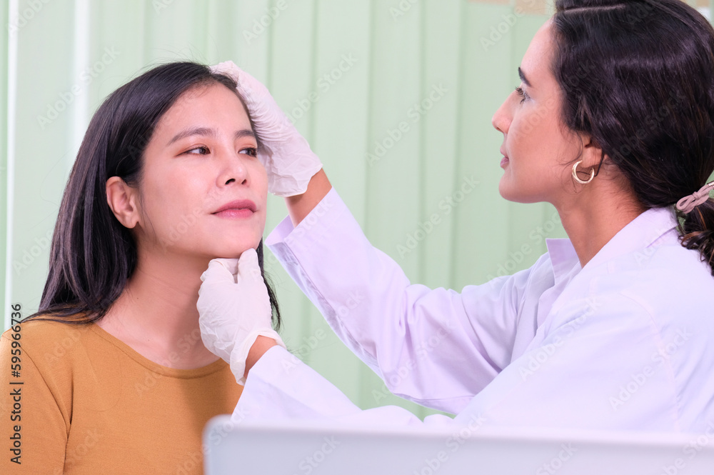 Young woman with a cosmetologist checking her face. Young woman with a cosmetologist checking her face.