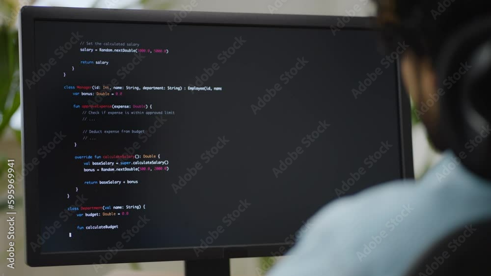 Hindus software engineer looks at monitor with source code