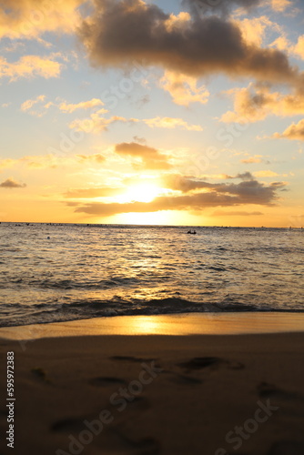landscape with mountains, clouds, beaches, sky, and orange skies of beautiful Hawaii