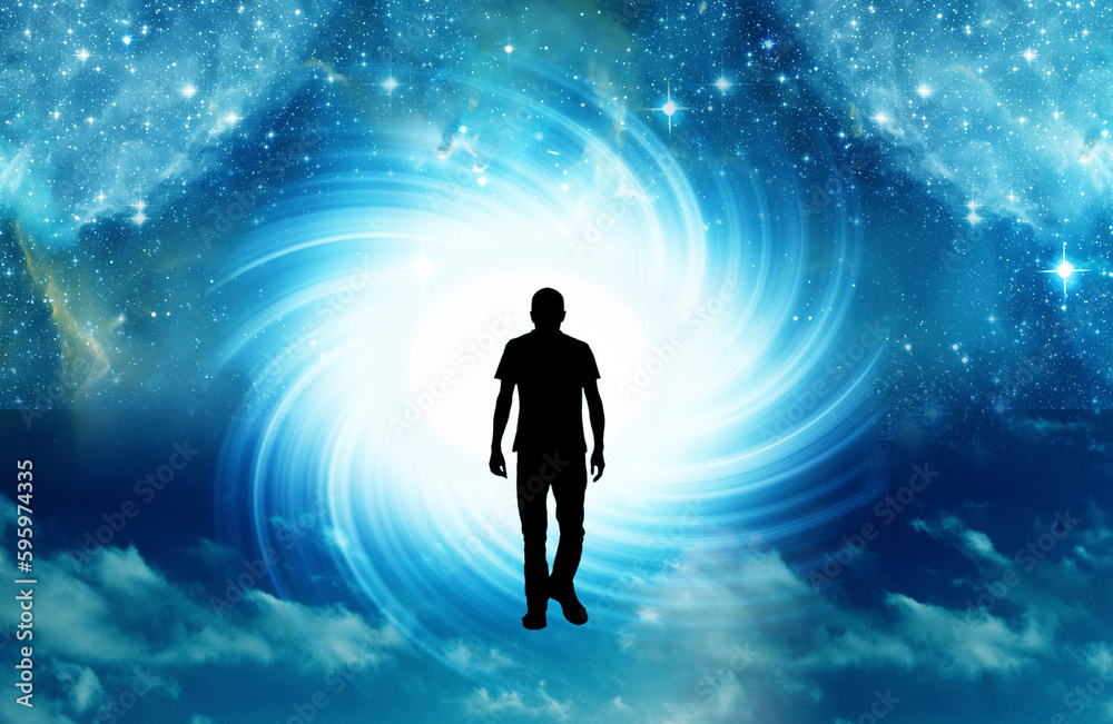 silhouette of man walking toward light cosmic whirl like spiritual concept, universe portal, mind and spirit 