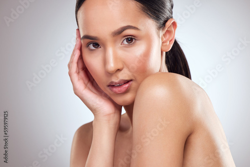 What a goddess. Studio portrait of a beautiful young woman posing against a grey background.