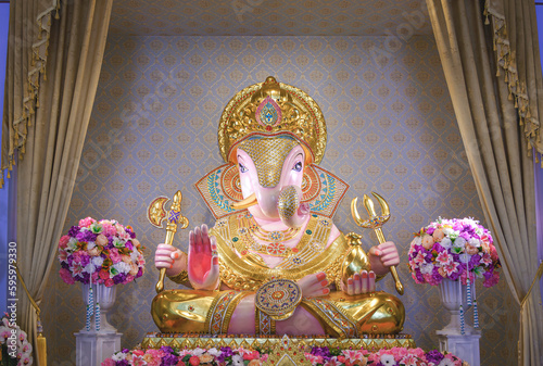 Beautiful Lord Ganesha Dagadusheth statue enshrined in a Hindu temple photo