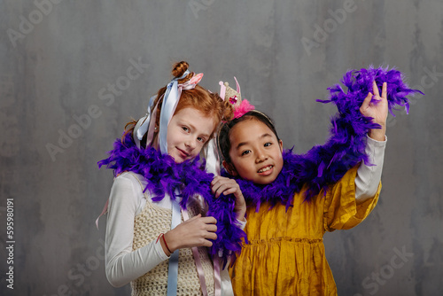 Portrait of children in funny costumes, studio shoot.