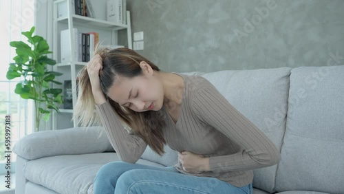 stomach ache. Asian women have abdominal pain, indigestion, gastritis, menstrual cramps, flatulence, diarrhea, distention, colon cancer, belly inflammation problem, suffer food poisoning, abdomen