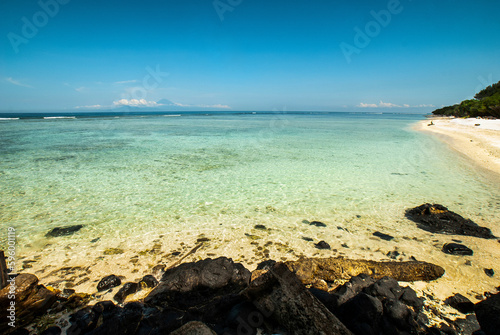 Beautiful coastline at tropical Gili Trawangan, the largest of the Gili islands, only a few hours away from the touristy area of Kuta, Bali, Indonesia photo