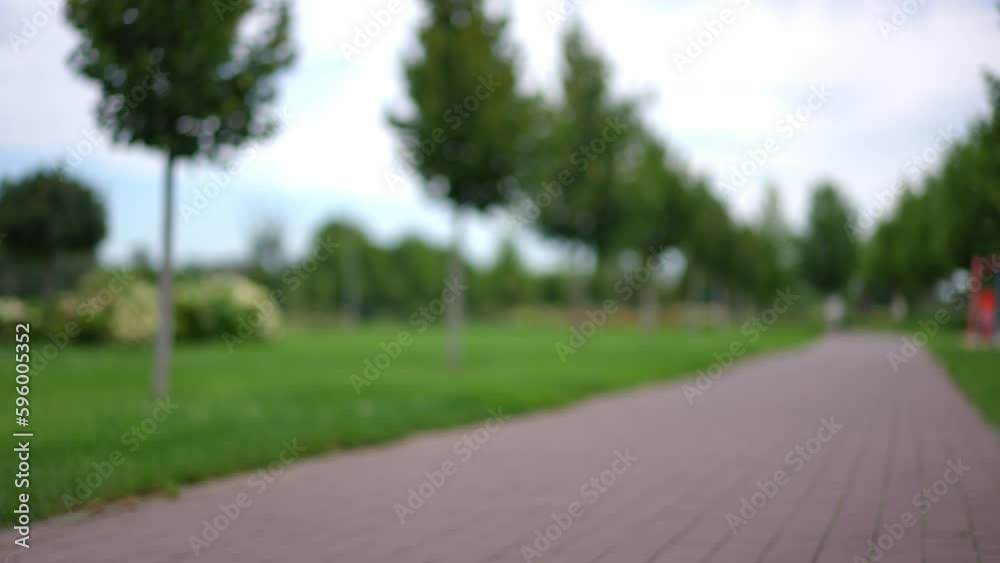 Portrait of adult man start running leaving in slow motion outdoors. Confident fit Caucasian sportsman training working out in spring summer park. Healthy lifestyle concept Portrait of adult man start running leaving in slow motion outdoors. Confident fit Caucasian sportsman training working out in spring summer park. Healthy lifestyle concept