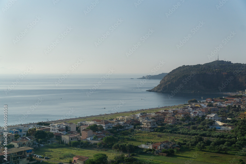 Milazzo city shore landscape in blue twilight with messina mountains