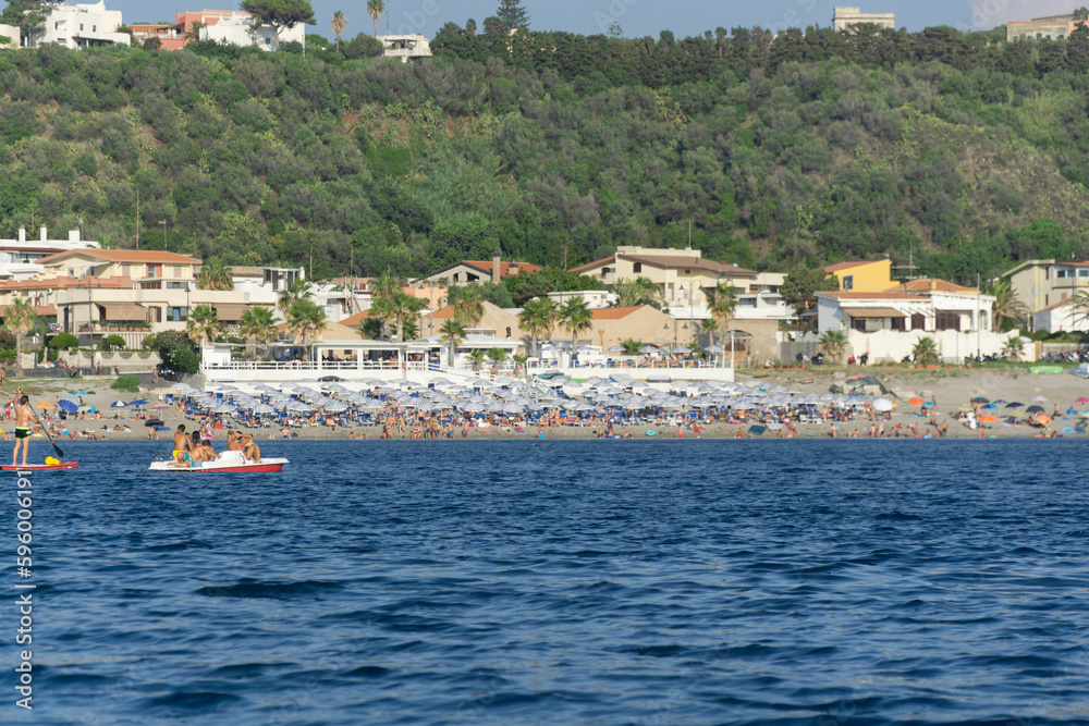 Vulcano city island beach with tourist landscape on sunny day 