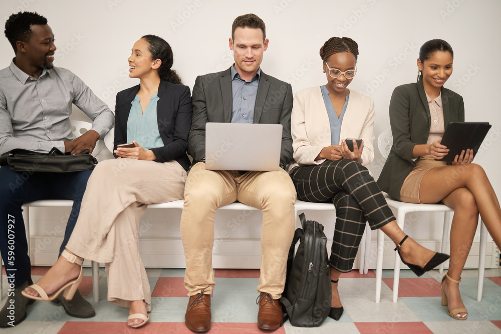 Were all here for a reason. a group of businesspeople waiting in line at an office. Were all here for a reason. a group of businesspeople waiting in line at an office.