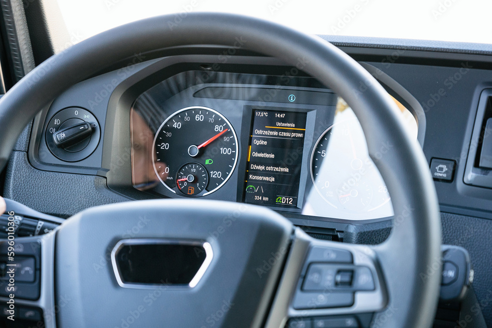 View from inside the cab of the truck. The truck is driving down the road. Car transport. View from inside the cab of the truck. The truck is driving down the road. Car transport.