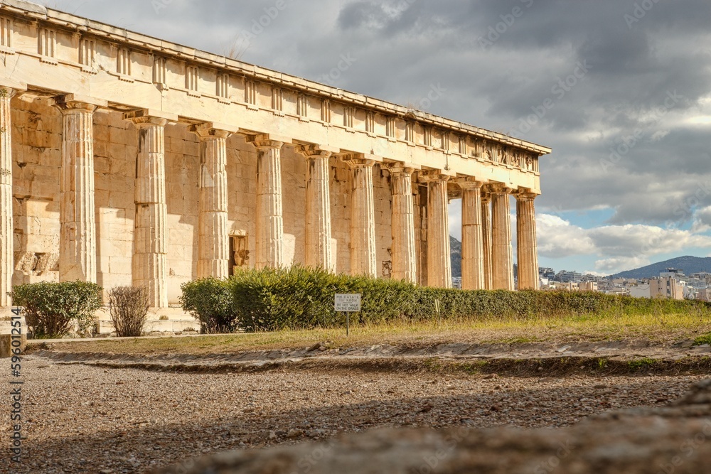 Fototapeta premium Temple of Hephaestus (Hephaisteion) in Agora of Athens, on top of the Agoraios Kolonos hill without people during sunny winter day 