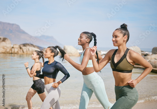 Cardio is cleansing for the soul. a group of women jogging together on the beach.