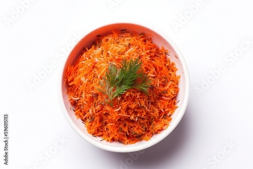Grated carrots in a white bowl. Ingredients for juice, salad, dishes, cuisine.