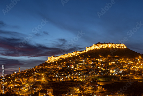 The city of Mardin, Turkey. Besides its stone houses and historical texture, Mardin impresses tourists with its night view. Long exposure high quality photo. photo