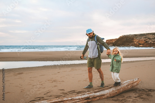 Family father walking with child on the beach summer vacations lifestyle travel together parent dad with daughter outdoor Fathers day holiday