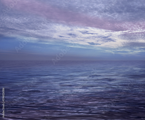 Beautiful atmospheric romantic cloudscape ocean horizon - lilac blue sea and moody clouds background ideal for a holistic, spiritual or holiday theme with cool calming colours and copy space for messa