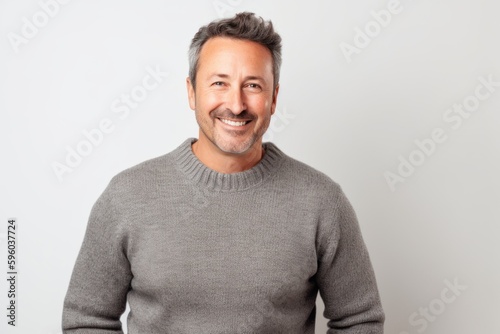 Portrait of a smiling middle-aged man on a white background © Robert MEYNER