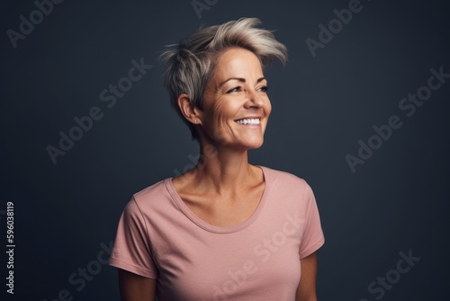 Portrait of a happy middle-aged woman with short blond hair