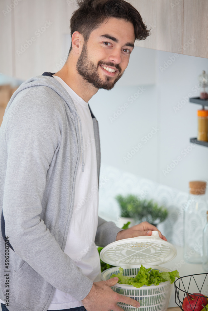 man in kitchen during making salad man in kitchen during making salad