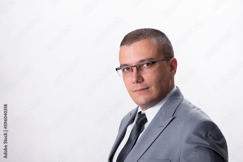Close-up portrait of serious businessman isolated on white background Close-up portrait of serious businessman isolated on white background