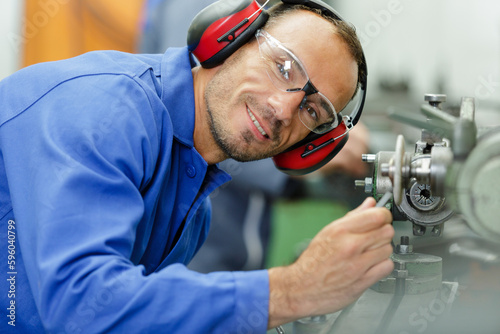 a happy smiling mechanic portrait photo